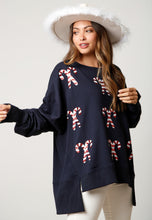 Load image into Gallery viewer, Candy Cane oversized sweatshirt on navy blue